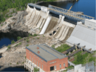 Photo of Big Eddy small hydropower plant with a concrete structure and water.